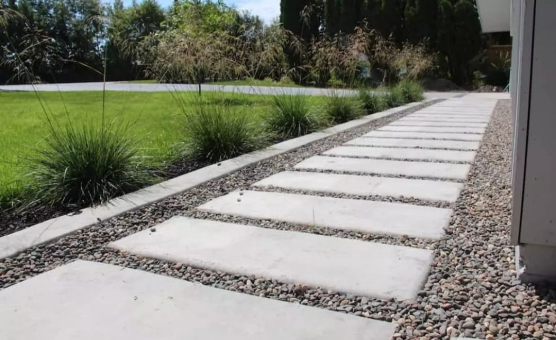an abstract photo of a curved building with a blue sky in the background