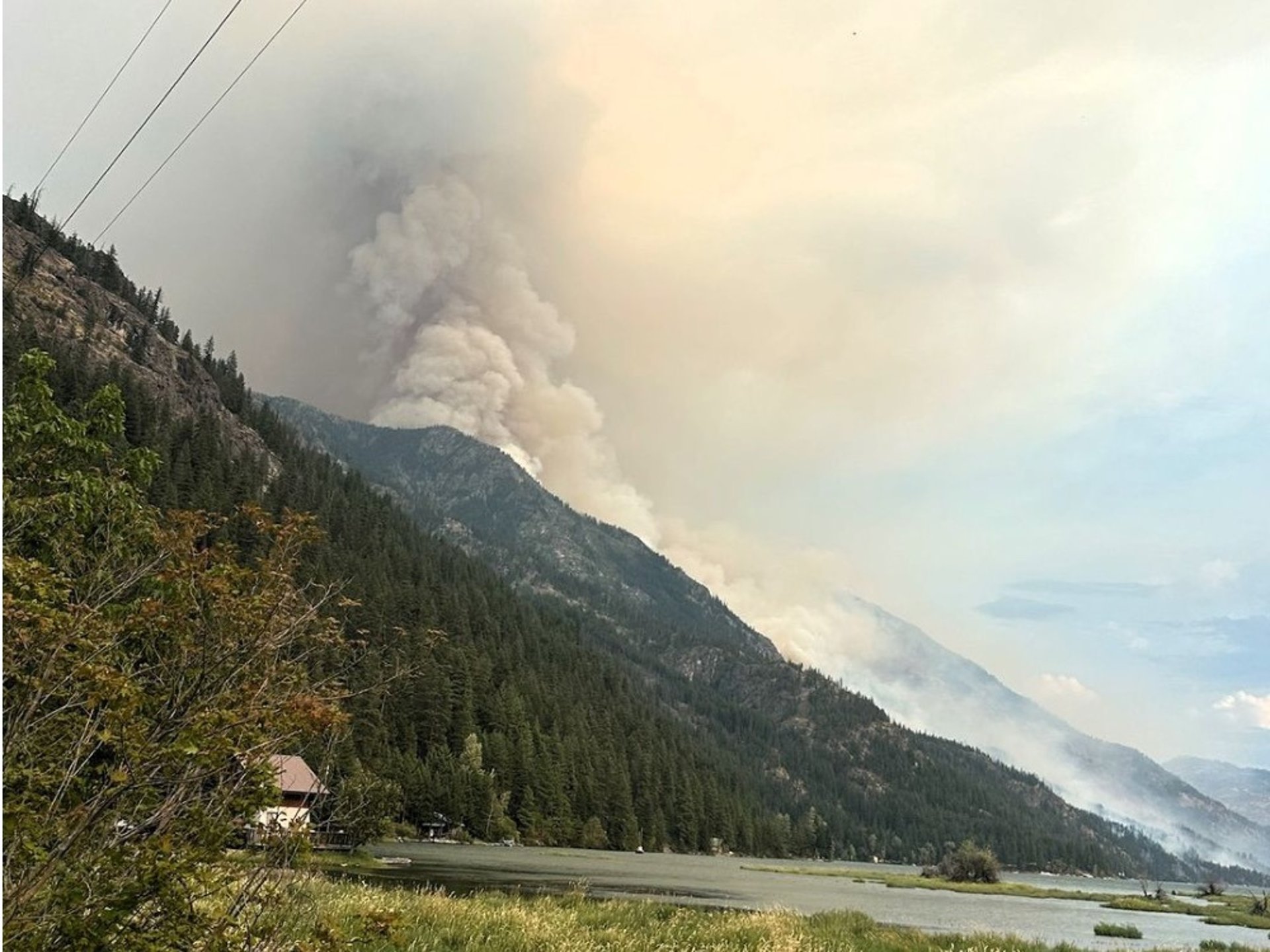 woman wearing yellow long-sleeved dress under white clouds and blue sky during daytime