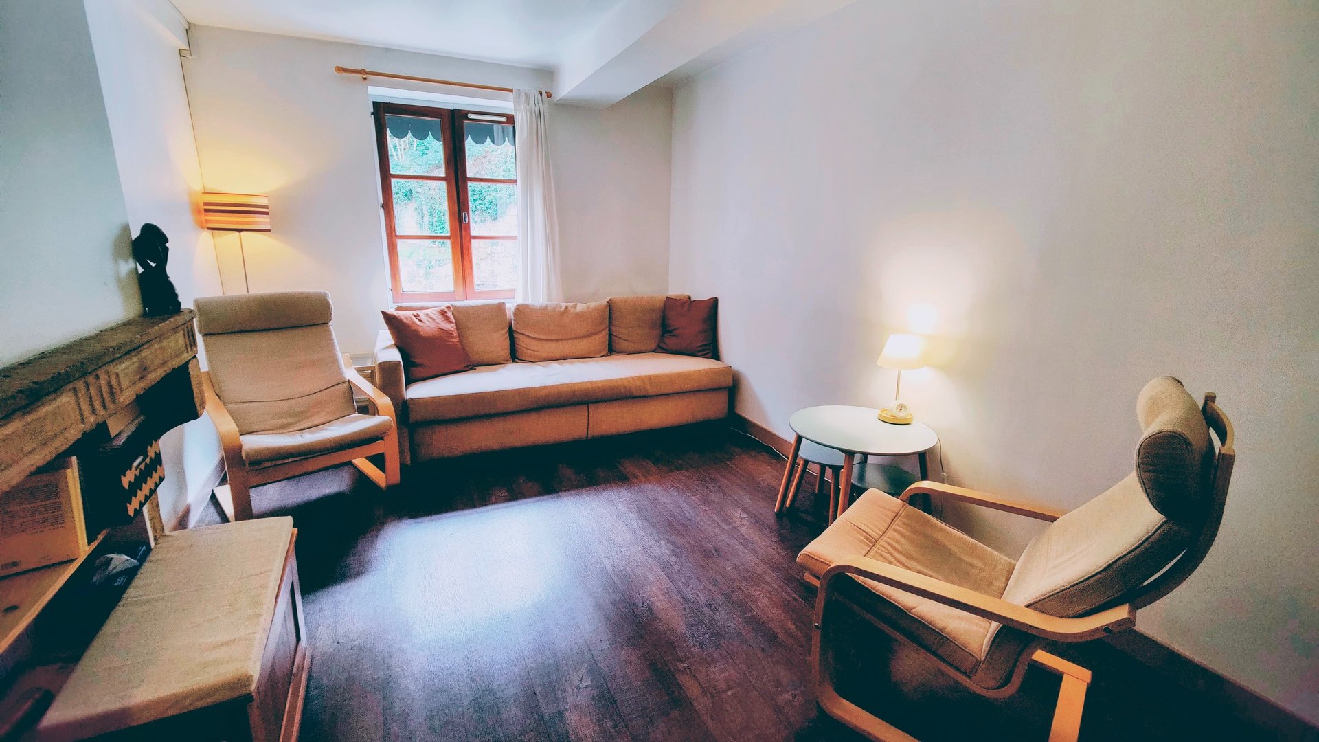 black and brown leather padded tub sofa