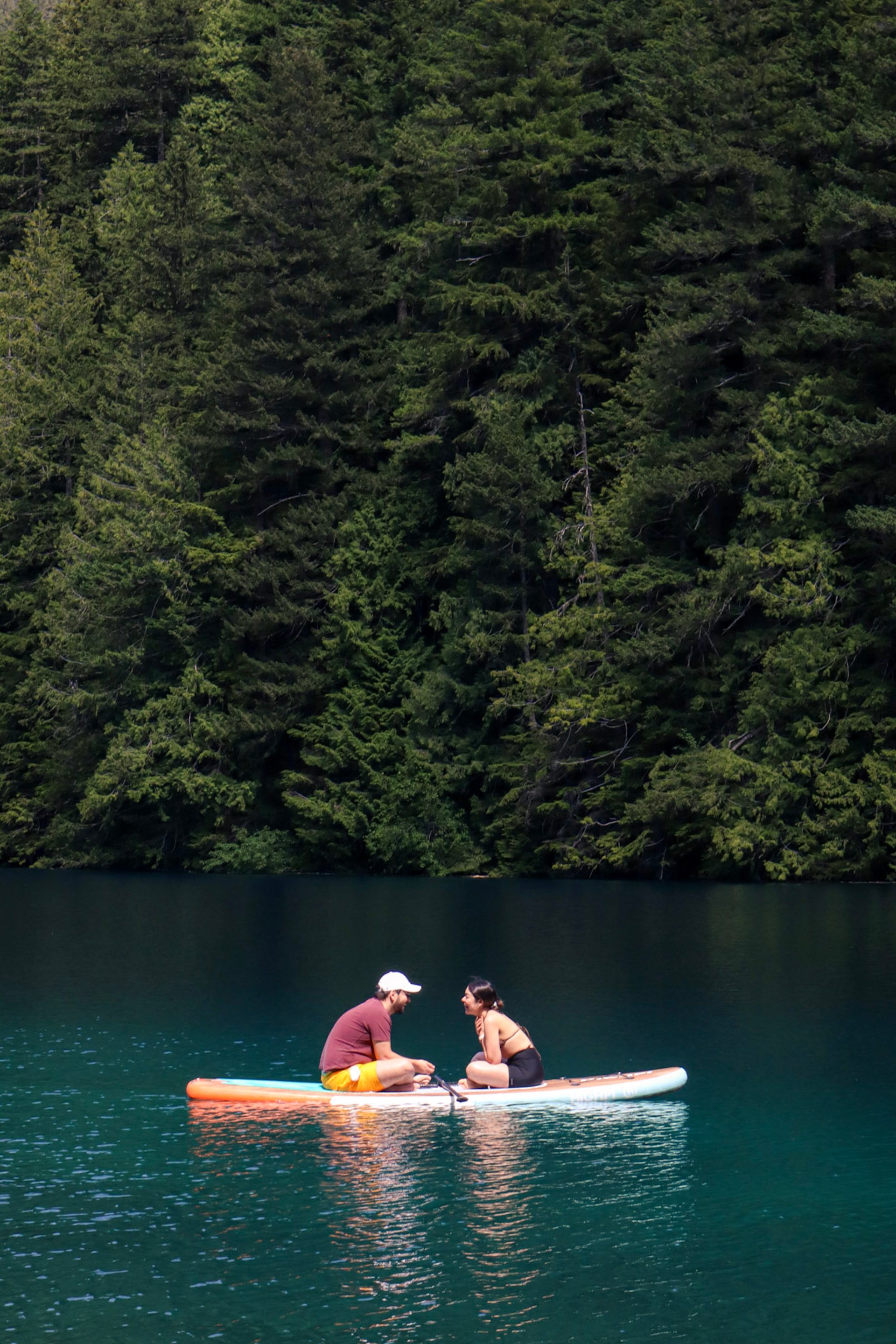 man in black suit and woman in white wedding dress