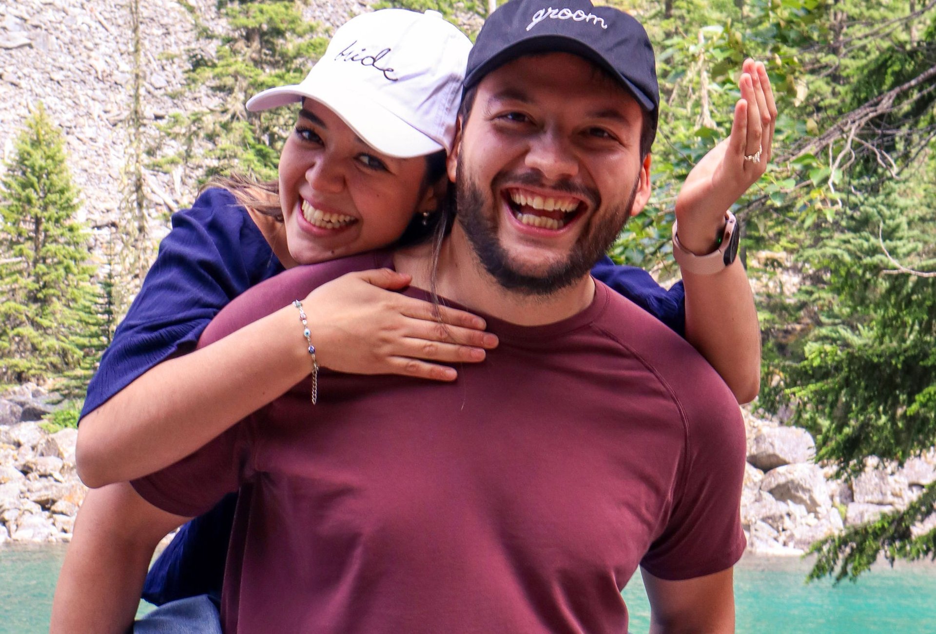 man kissing on woman forehead standing near tree during daytime
