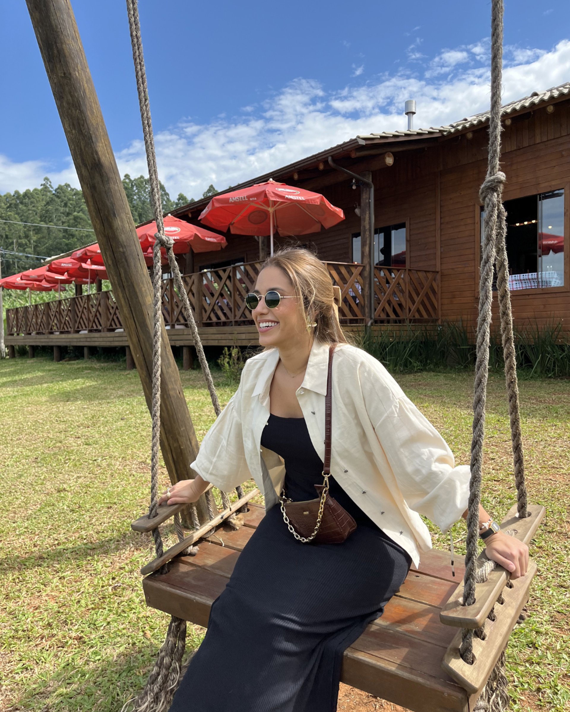 woman wearing yellow long-sleeved dress under white clouds and blue sky during daytime