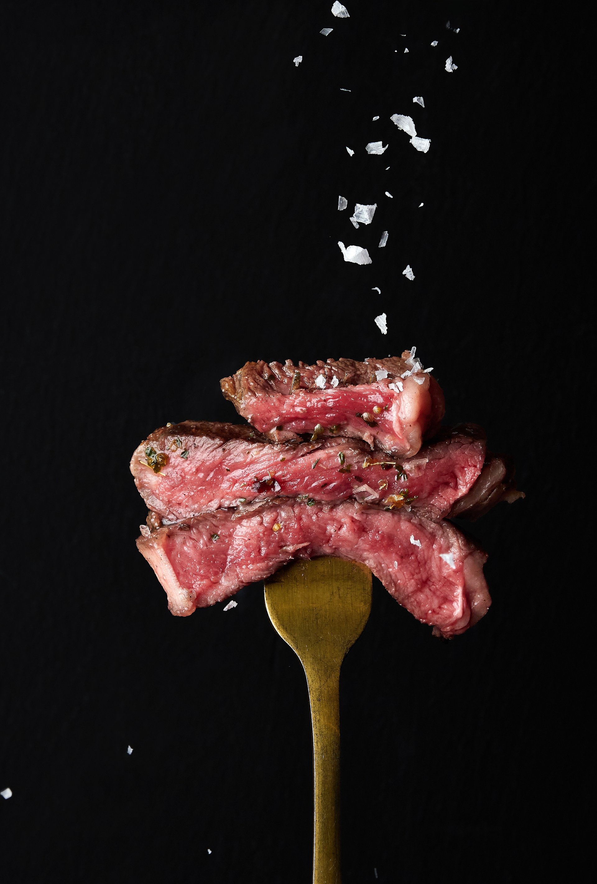 an abstract photo of a curved building with a blue sky in the background