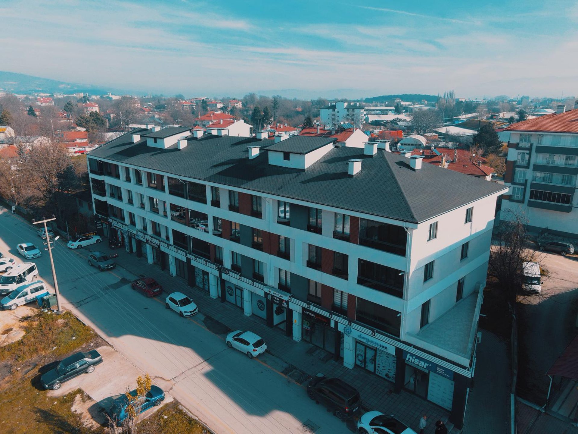 a tall building with a crane on top of it