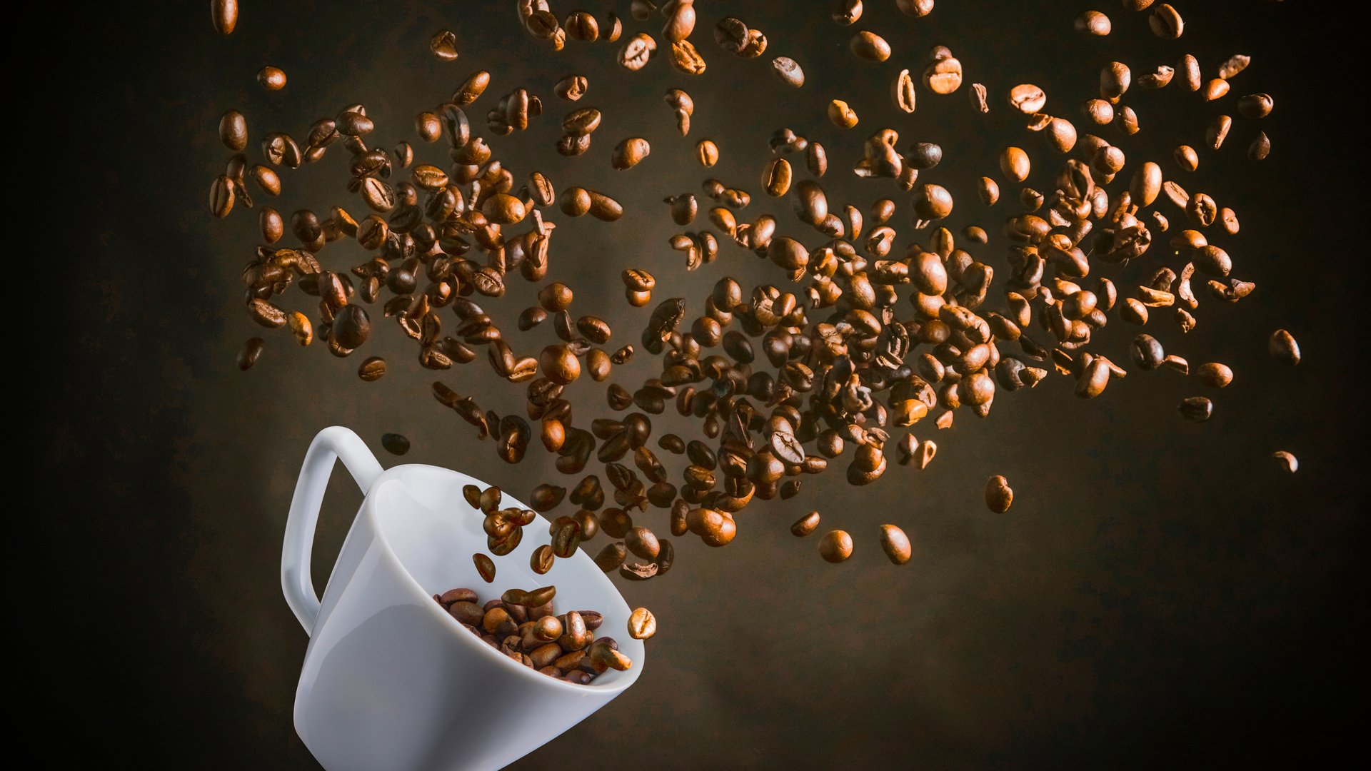an abstract photo of a curved building with a blue sky in the background