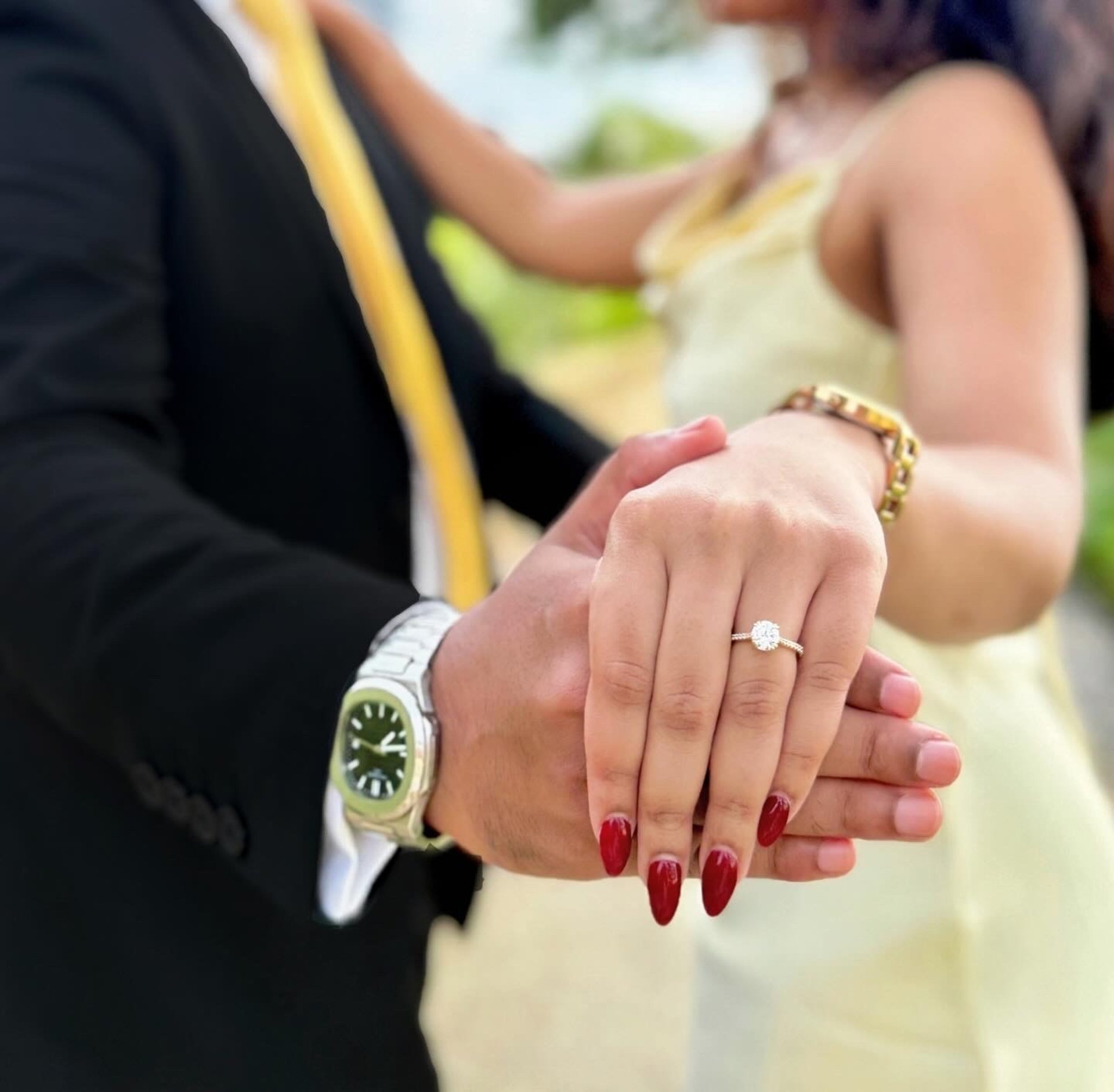 couple wearing silver-colored rings