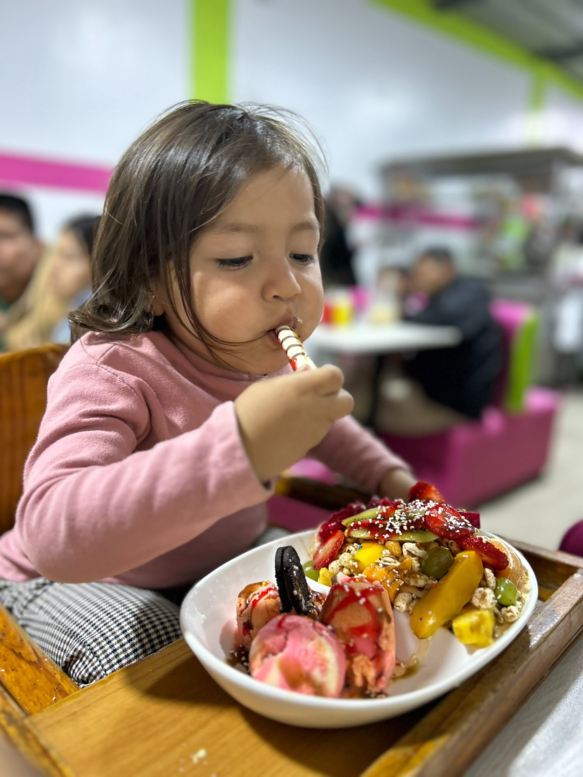 a wooden table topped with plates of food and drinks