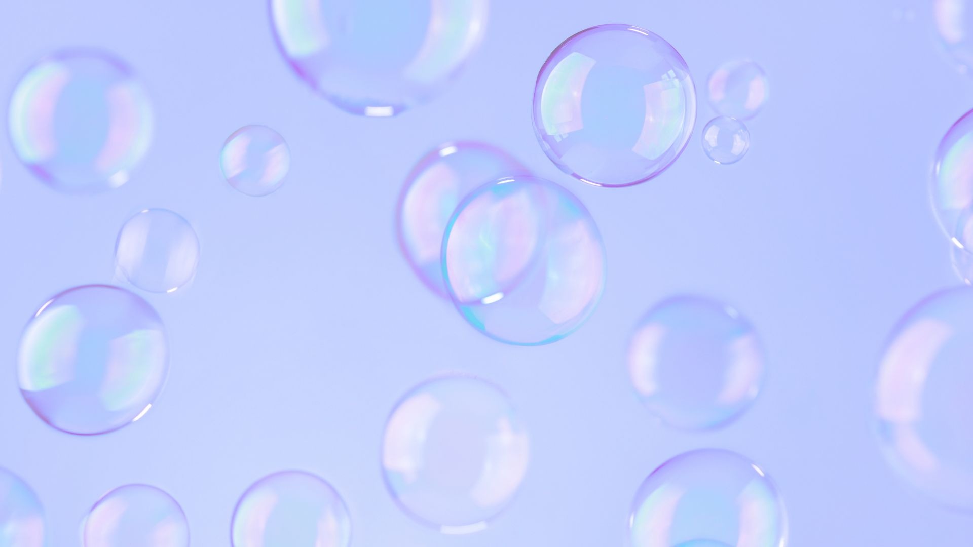 person in blue gloves holding white textile