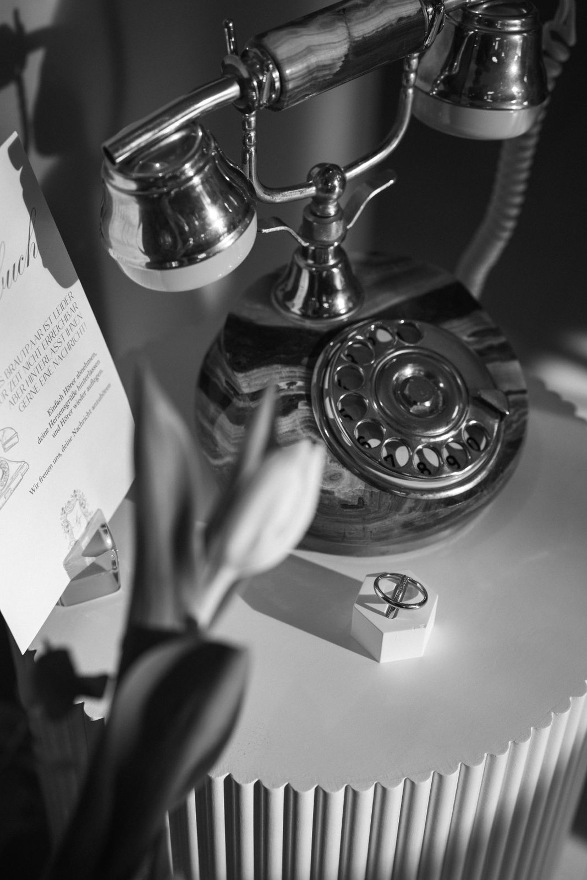 black leather strap on white textile