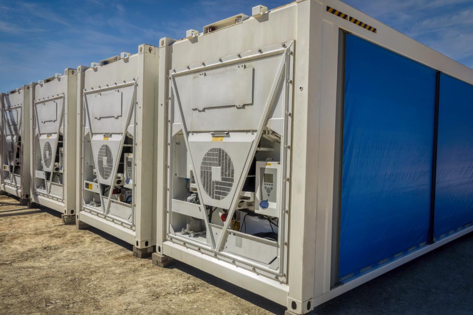 woman wearing yellow long-sleeved dress under white clouds and blue sky during daytime