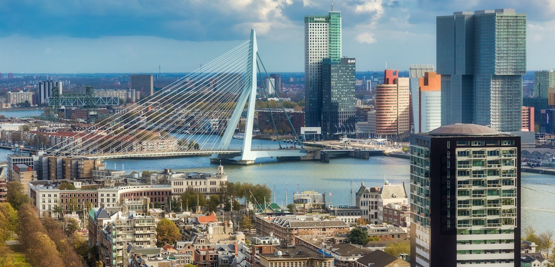 an abstract photo of a curved building with a blue sky in the background