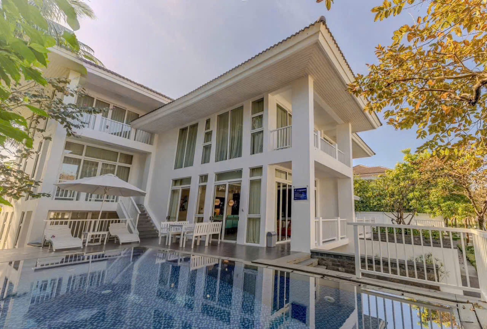 person riding on skis during winter surrounded by mountains