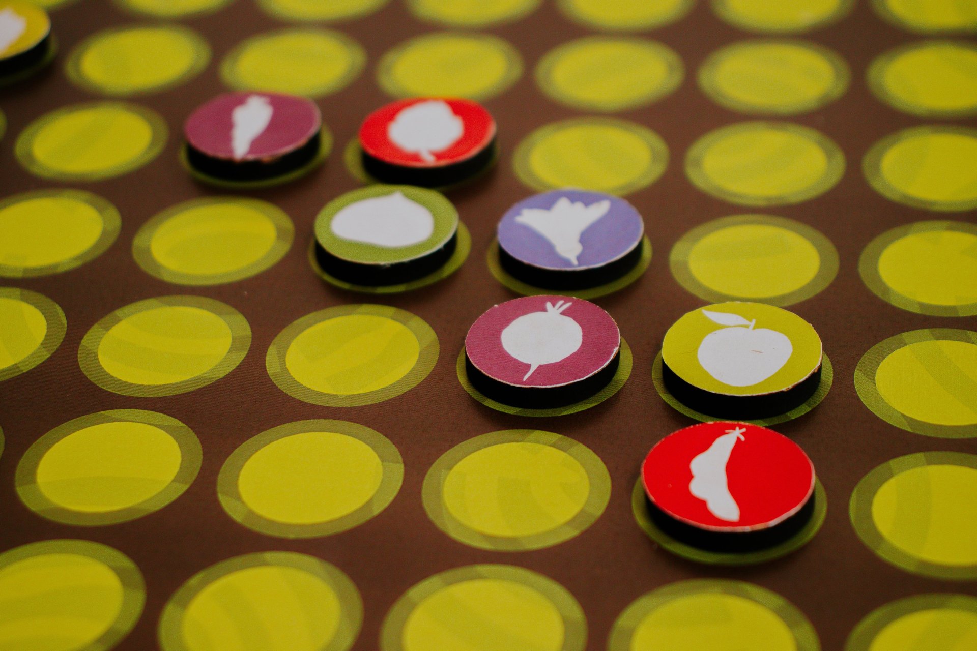 a group of women sitting around a table playing a game