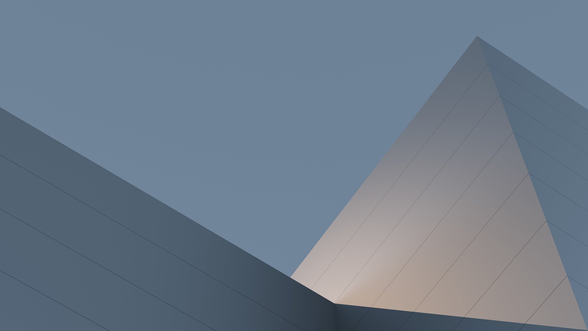 an abstract photo of a curved building with a blue sky in the background