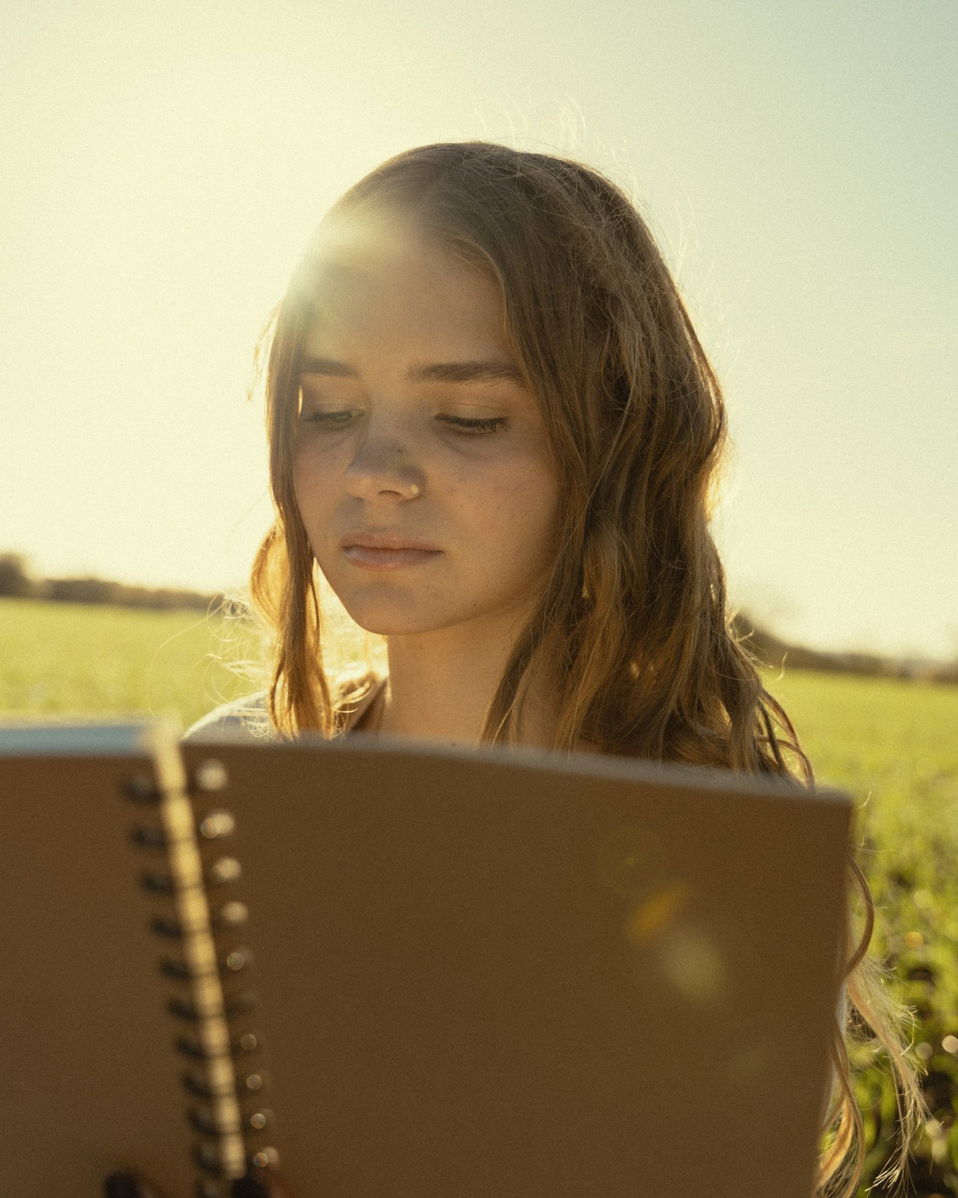 woman wearing yellow long-sleeved dress under white clouds and blue sky during daytime