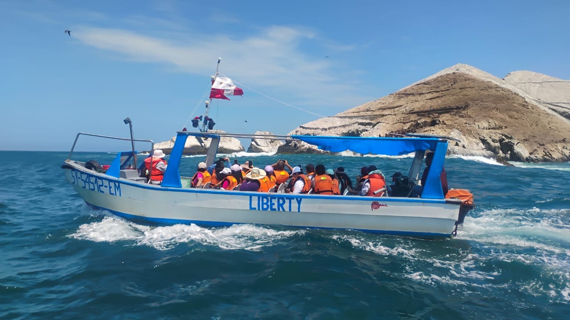an abstract photo of a curved building with a blue sky in the background