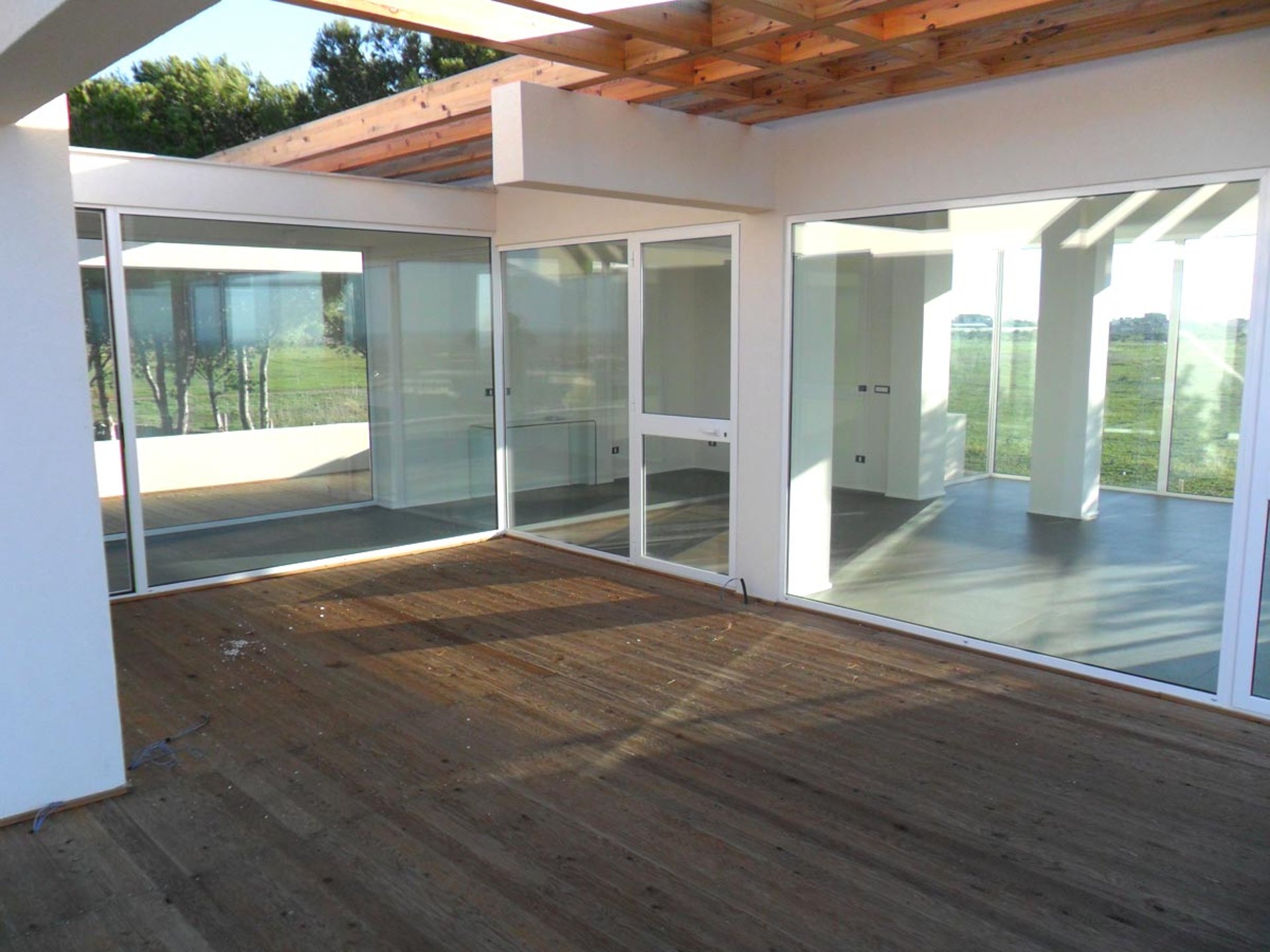 an abstract photo of a curved building with a blue sky in the background