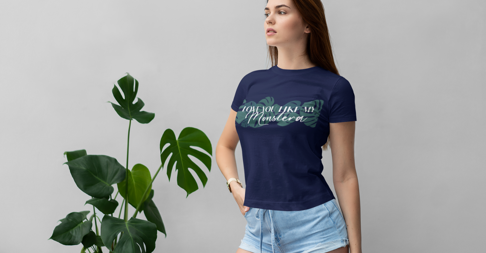 Woman wearing a plant-themed T-shirt styled with botanical accents — Miss Chatty Plants apparel.