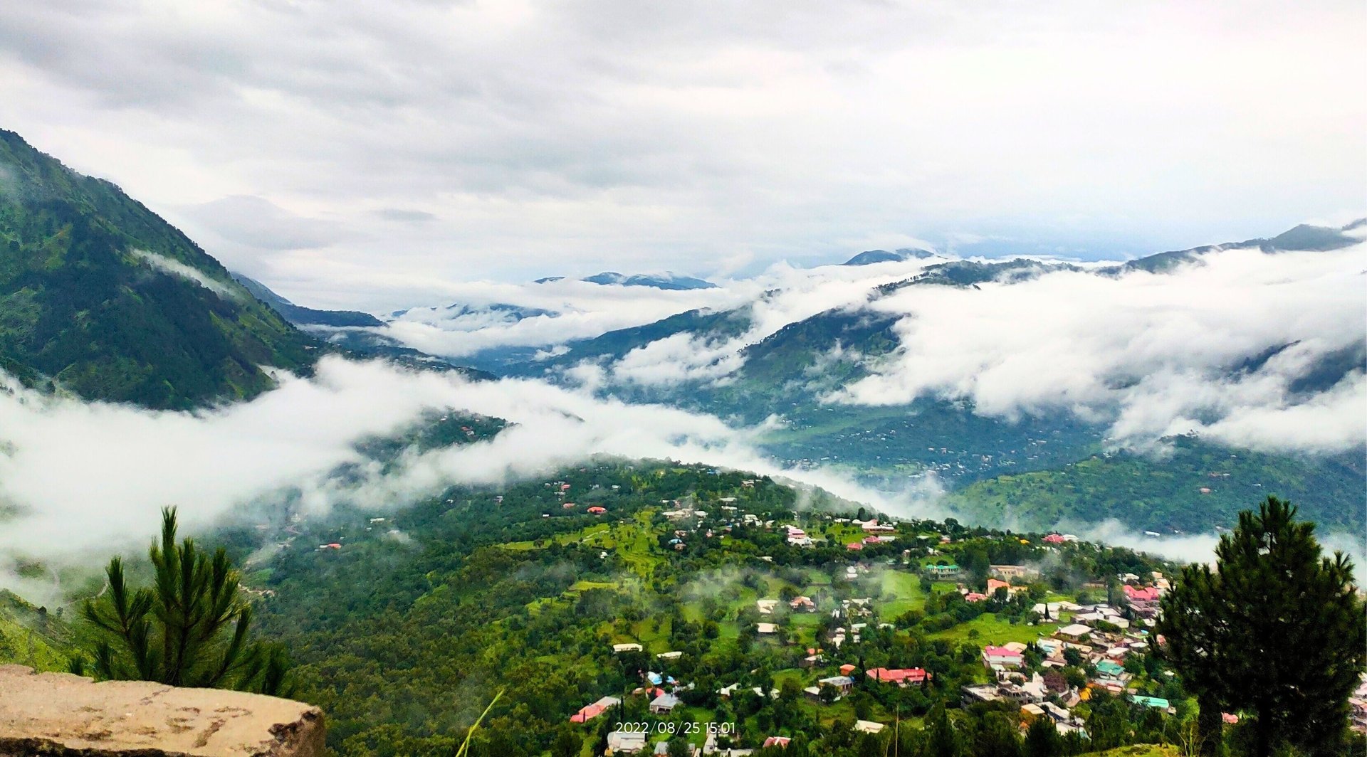 Panoramic view of Moolia village nathiagali , partially covered with clouds 