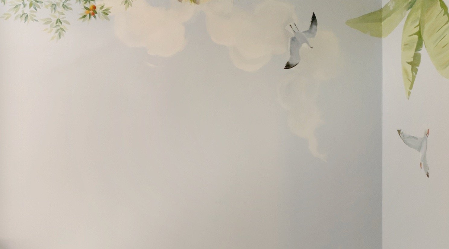 Hand-painted nursery mural sky with seagulls, clouds, and soft morning light — part of an Australian wildlife theme