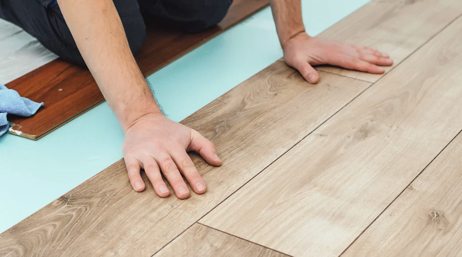 Flooring installer is installing floating type flooring.