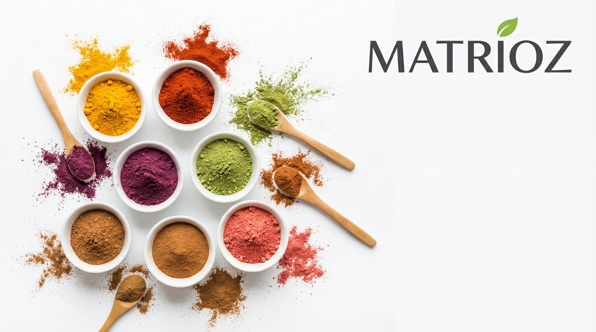 Various colorful powders, including turmeric, matcha, paprika, and more, in white bowls with spoons, representing natural