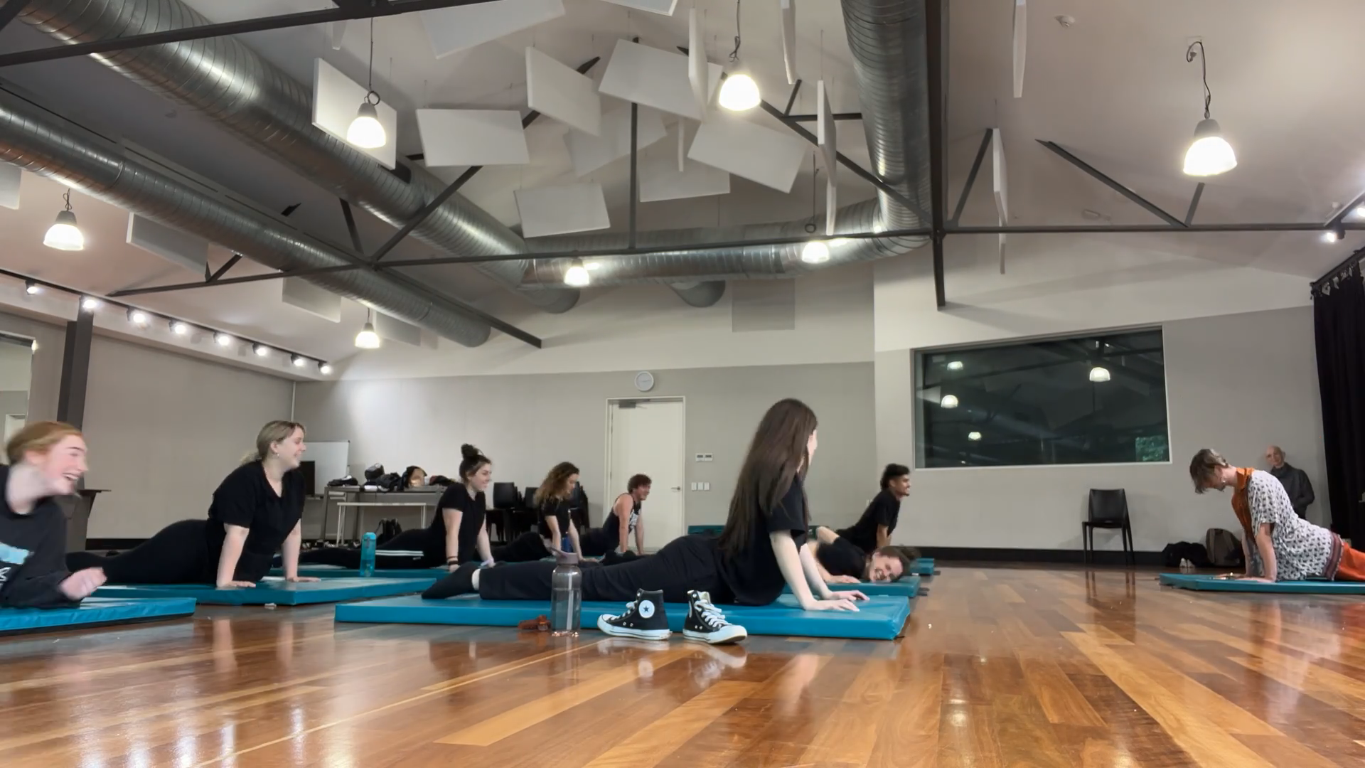 a group of people doing yoga exercises on their own mats