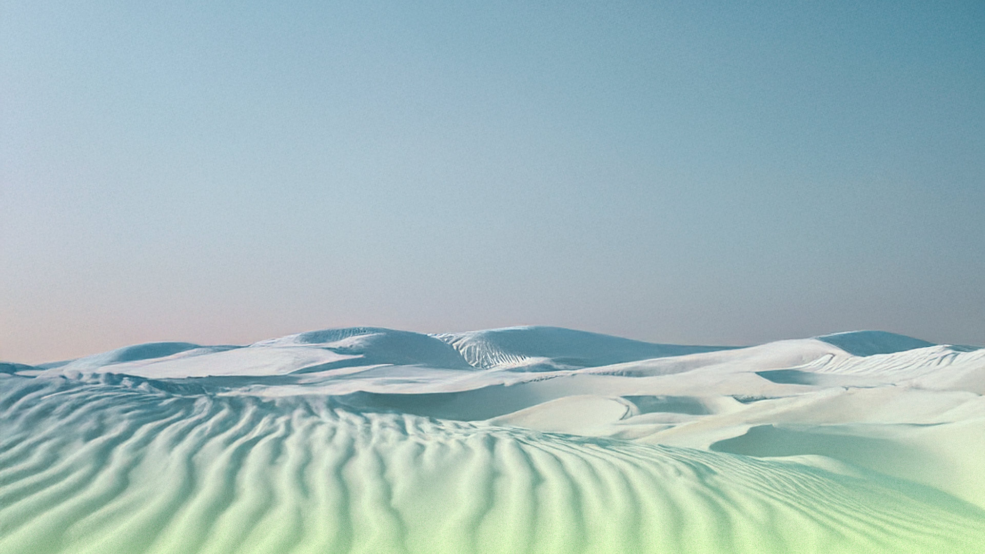 Landscape made of white sand dunes with a neutral blue sky