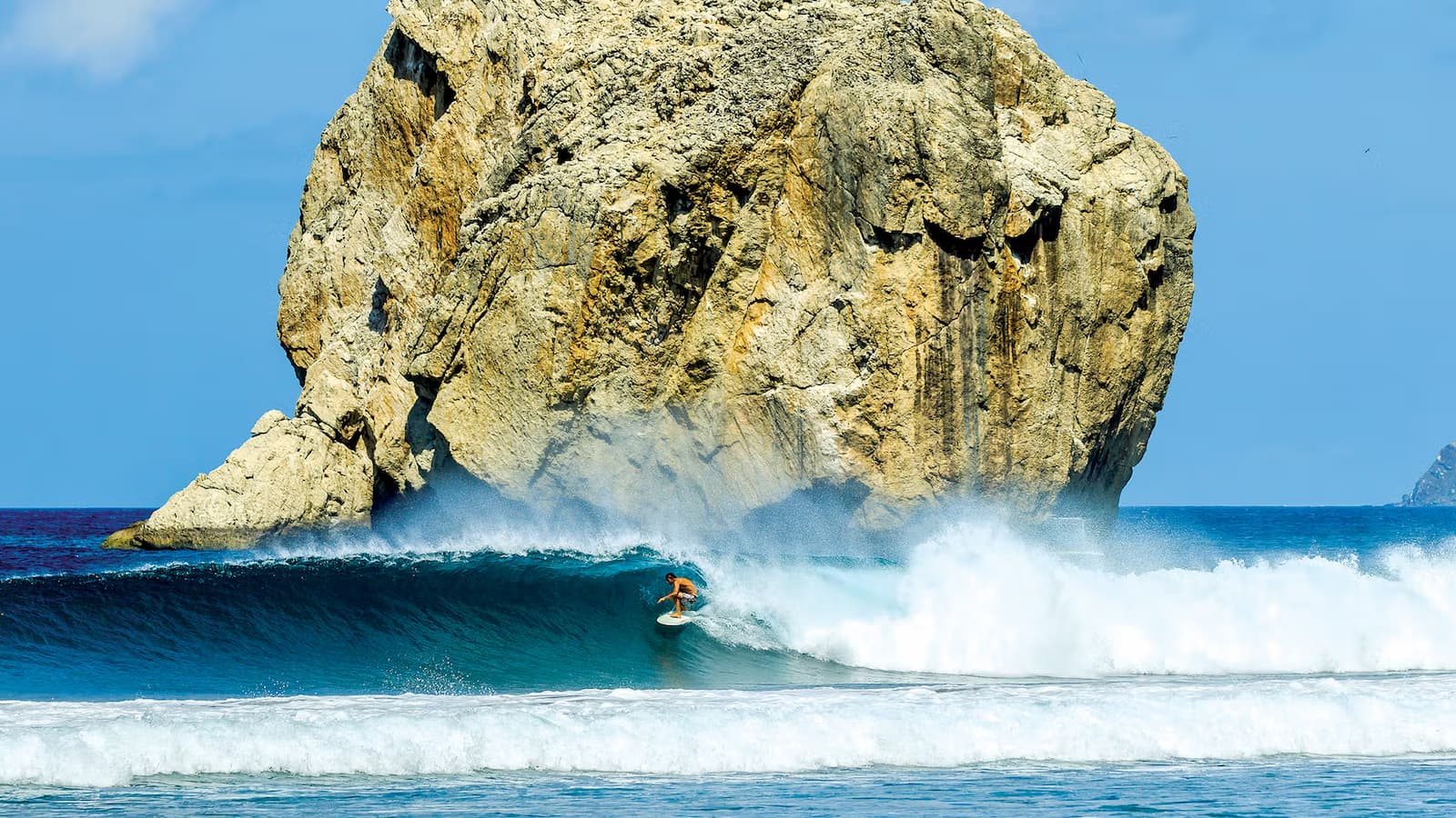 Surfing lessons at Witches Rock, Guanacaste, available with catamaran tour Costa Rica