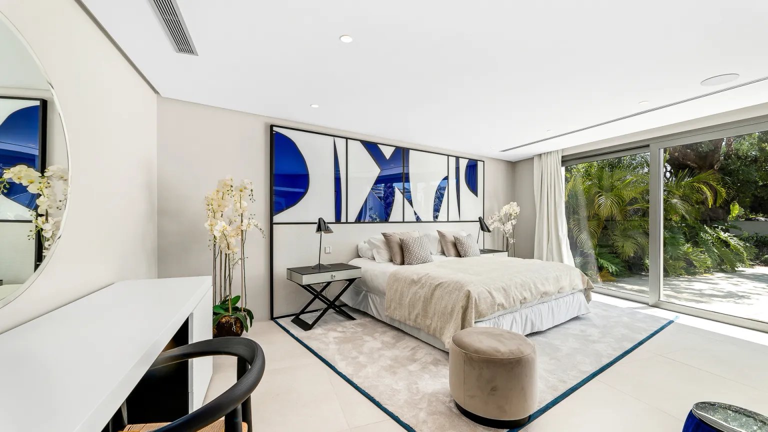 Contemporary bedroom with terrace views at Villa Serenity