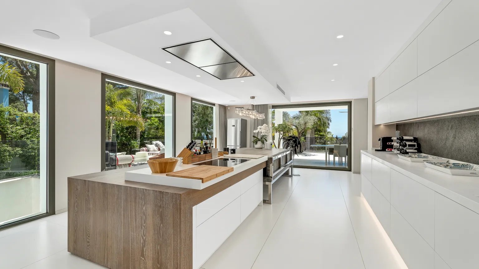 Modern white kitchen with island at Villa Serenity