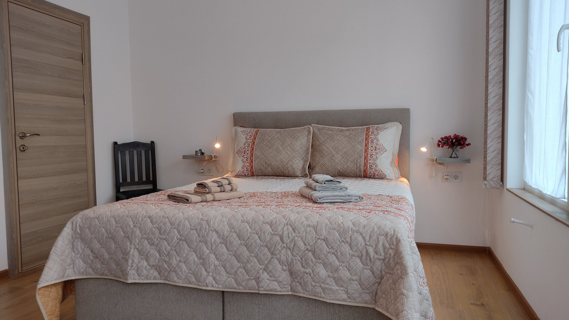 alt="Harmony Apartment bedroom with cozy bed and modern decor"