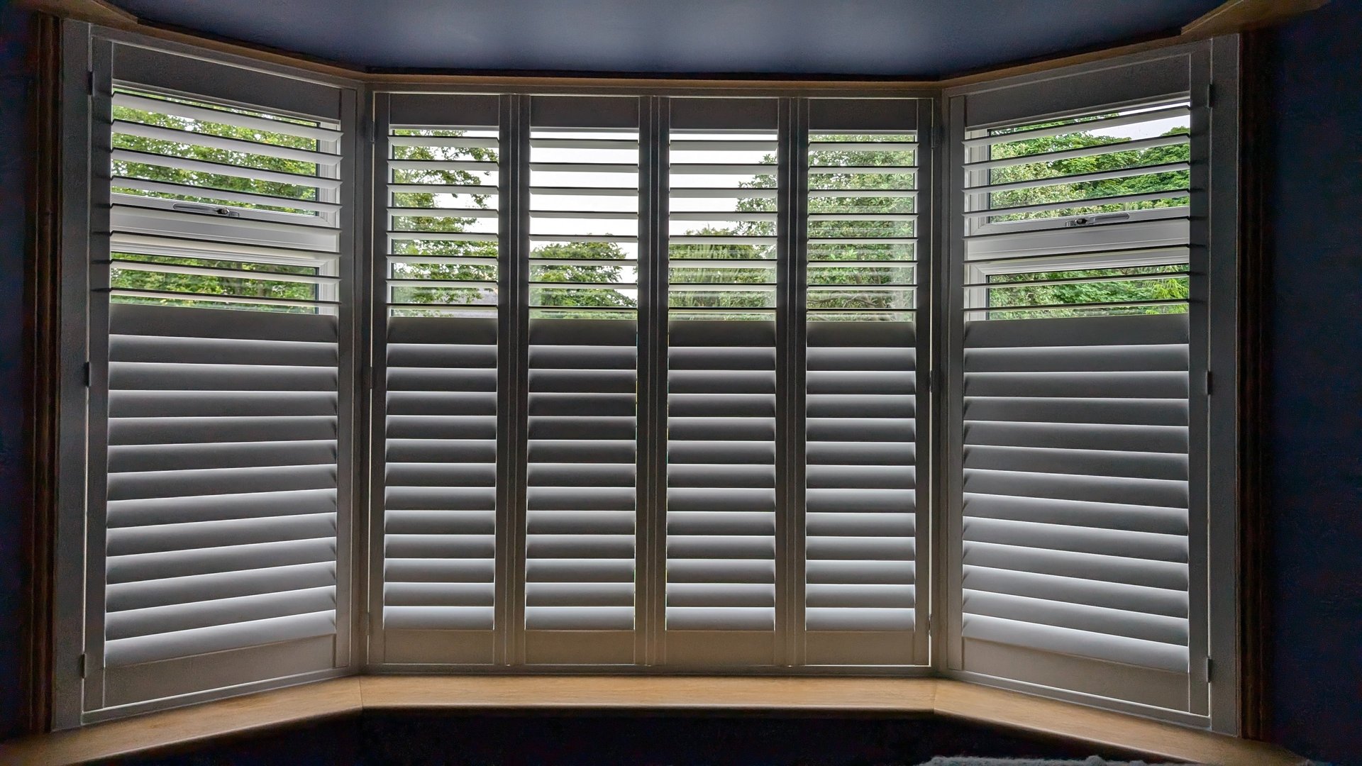 White plantation shutters fitted to bay window in Aberdeen home