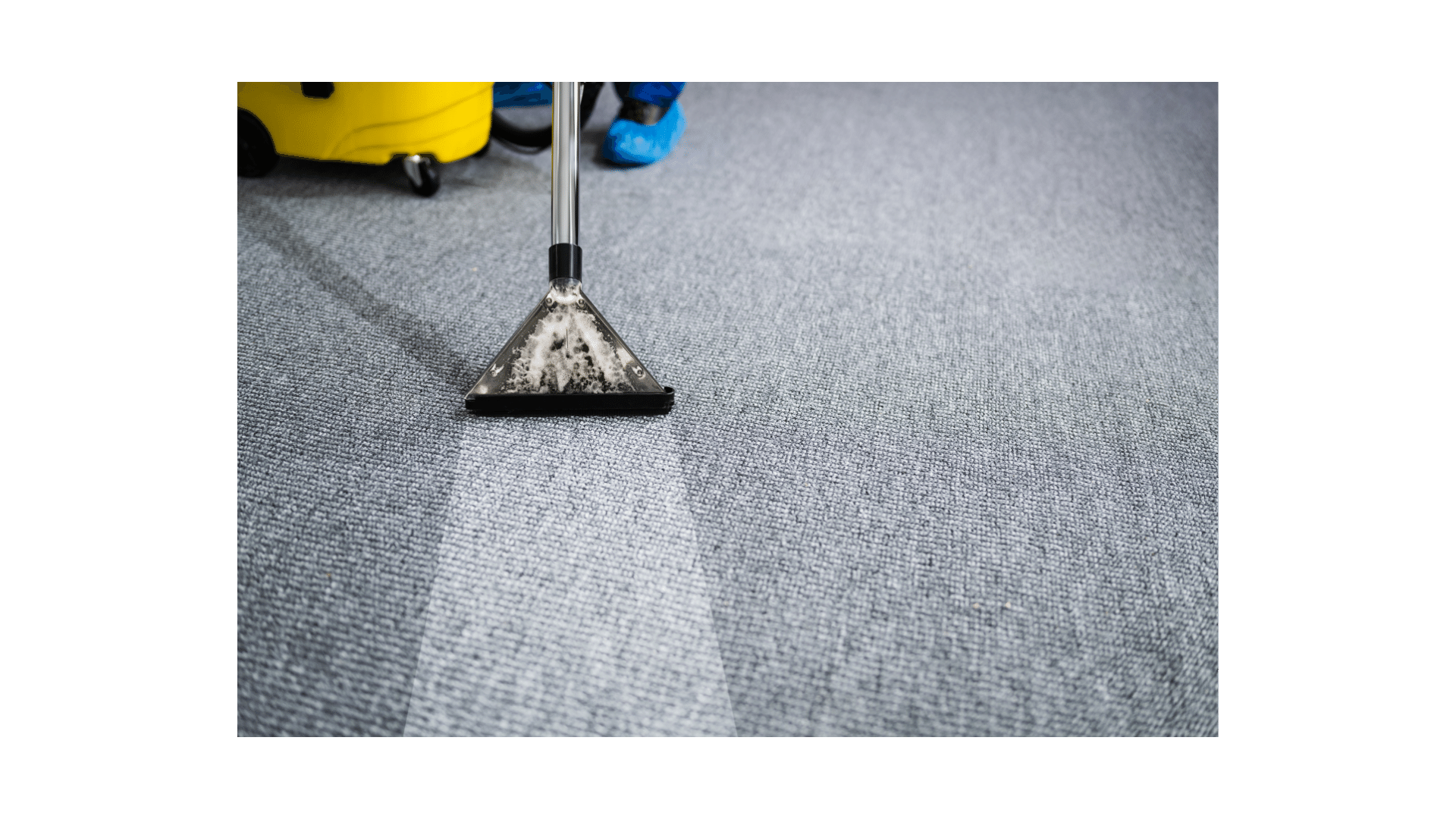 a person cleaning a carpet with a broom