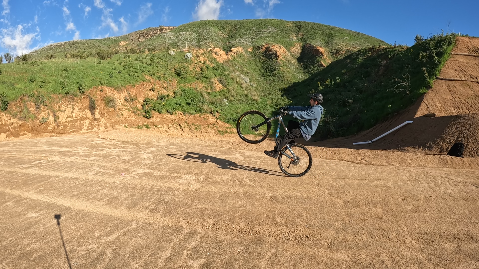 mountain biker doing a wheelie