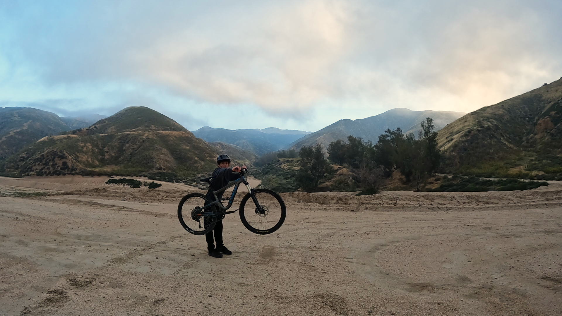 Practice bunnyhop by standing next to bike and lifting front wheel then rear wheel