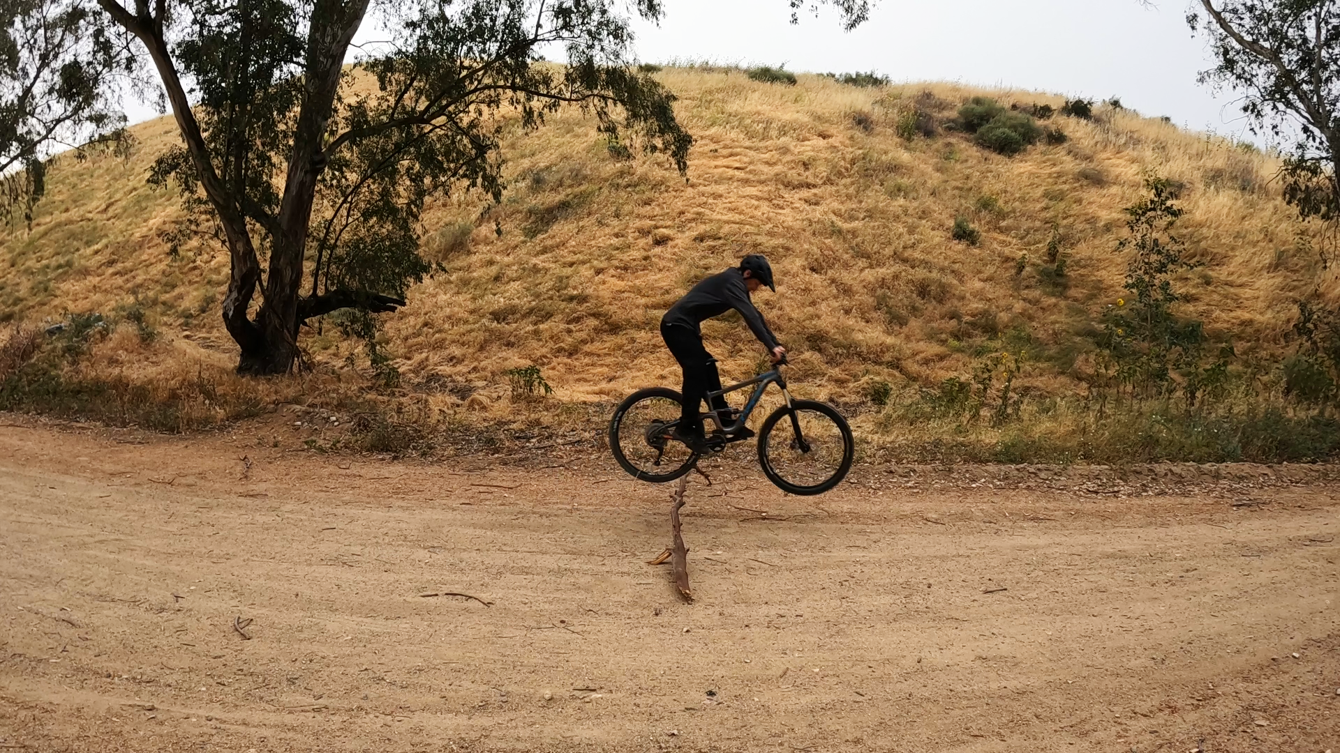 mountain biker leveling out bike after doing a bunnyhop