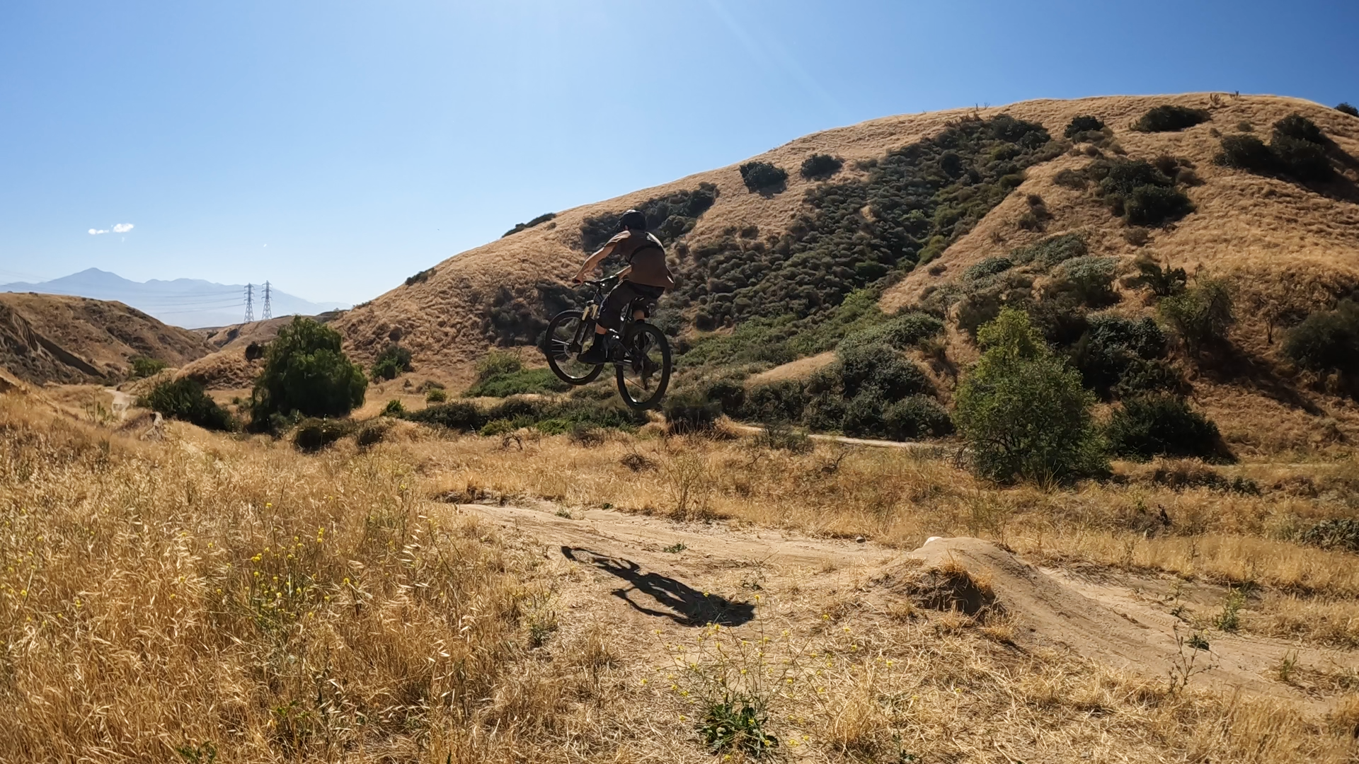 mountain biker in the air off a jump