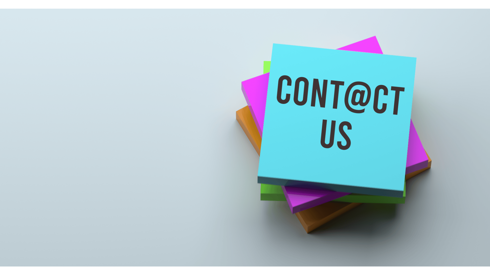 a stack of sticky notes with a note pad attached to it. Contact us page.