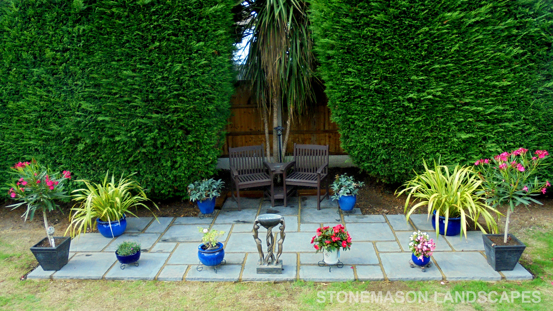 Replica antique stone grey paving slabs patio kit with bench and flowers