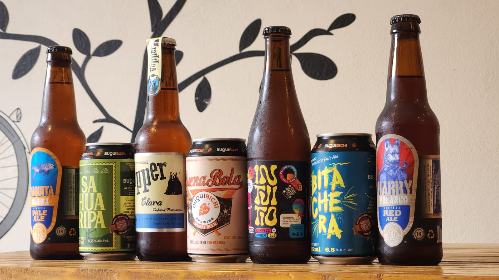 a bunch of beer bottles sitting on a table