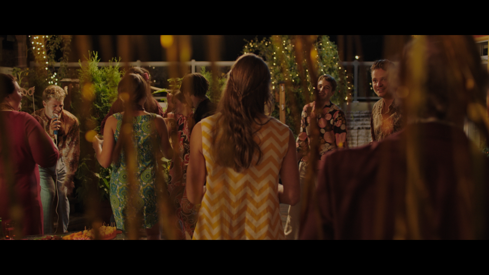 a group of people standing around a table