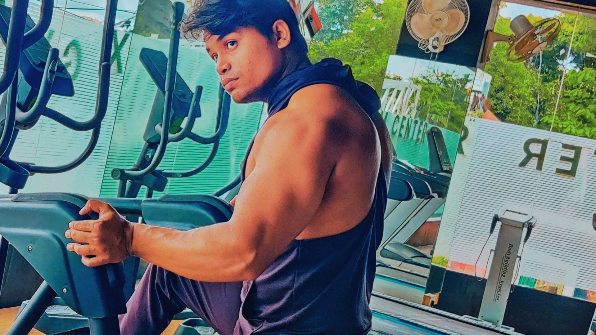 a man in a tank top and a woman in a tank top