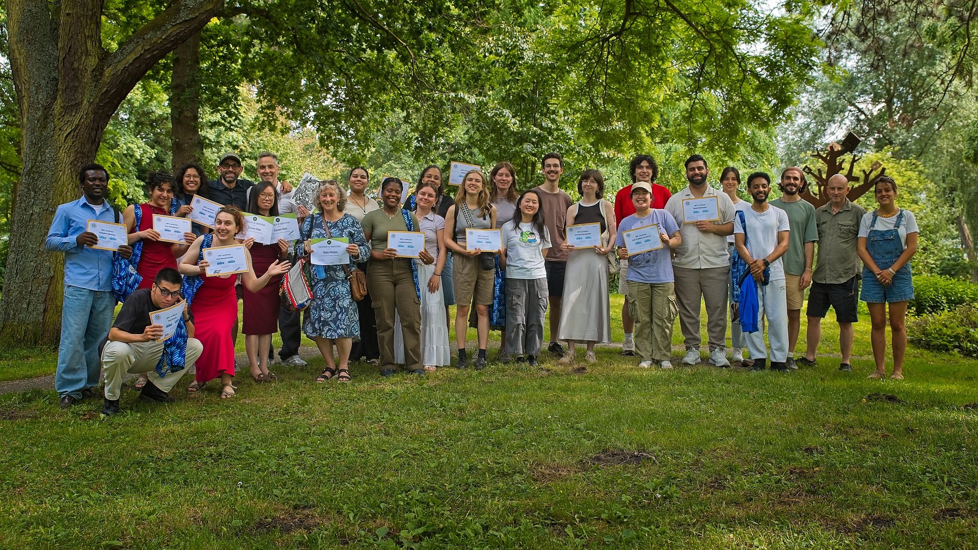 Participants of the MDT Documentary Impact Challenge pose with certificates and teachers