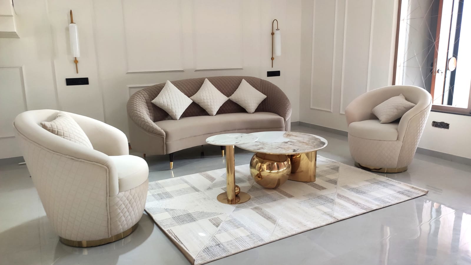 Living room interior design with three seater couch sofa two chairs. marble centre table neoclassic