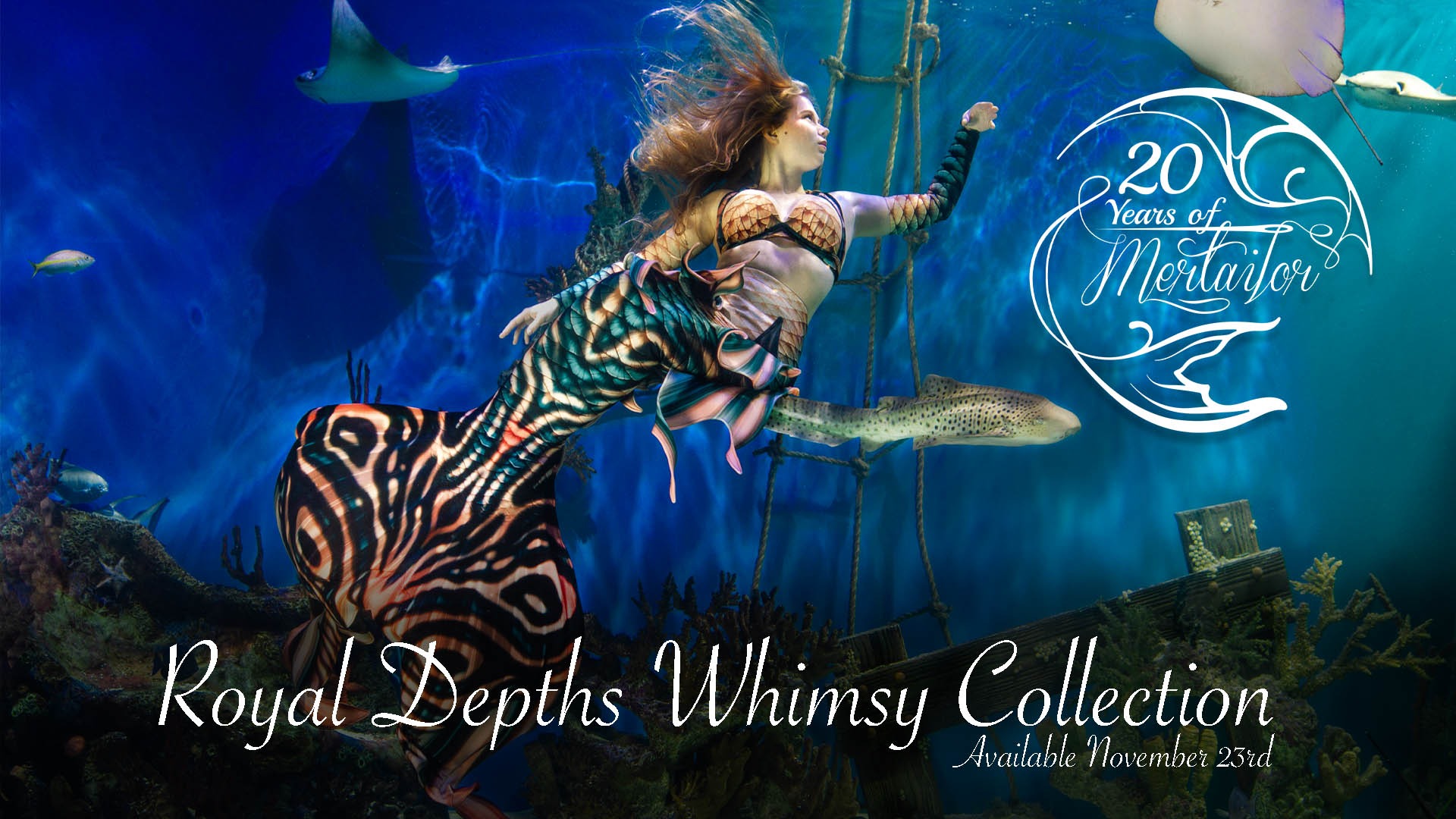 A mertailor performing mermaid wearing an elaborate whimsy tail underwater.