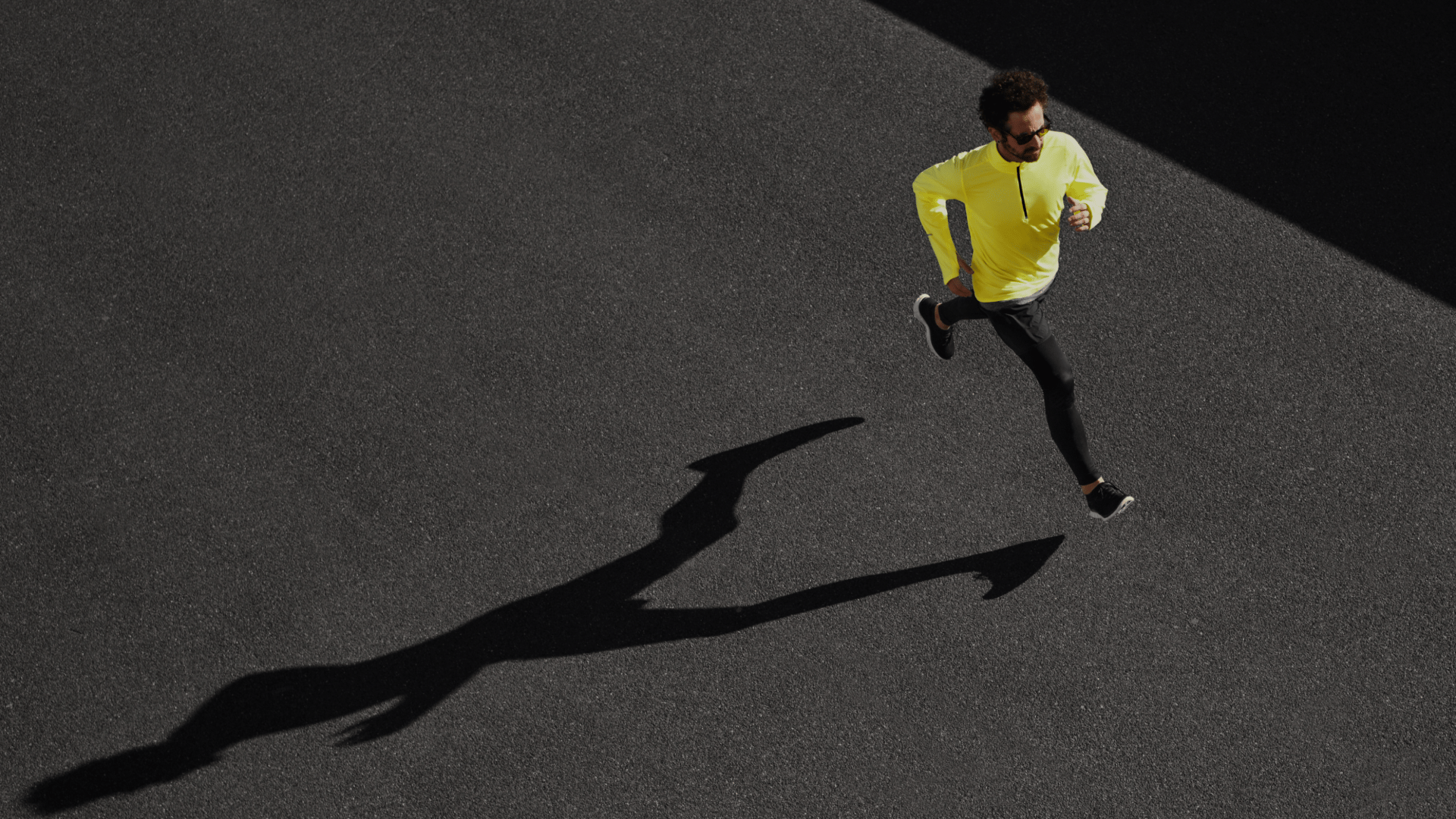 a man running on a tennis court