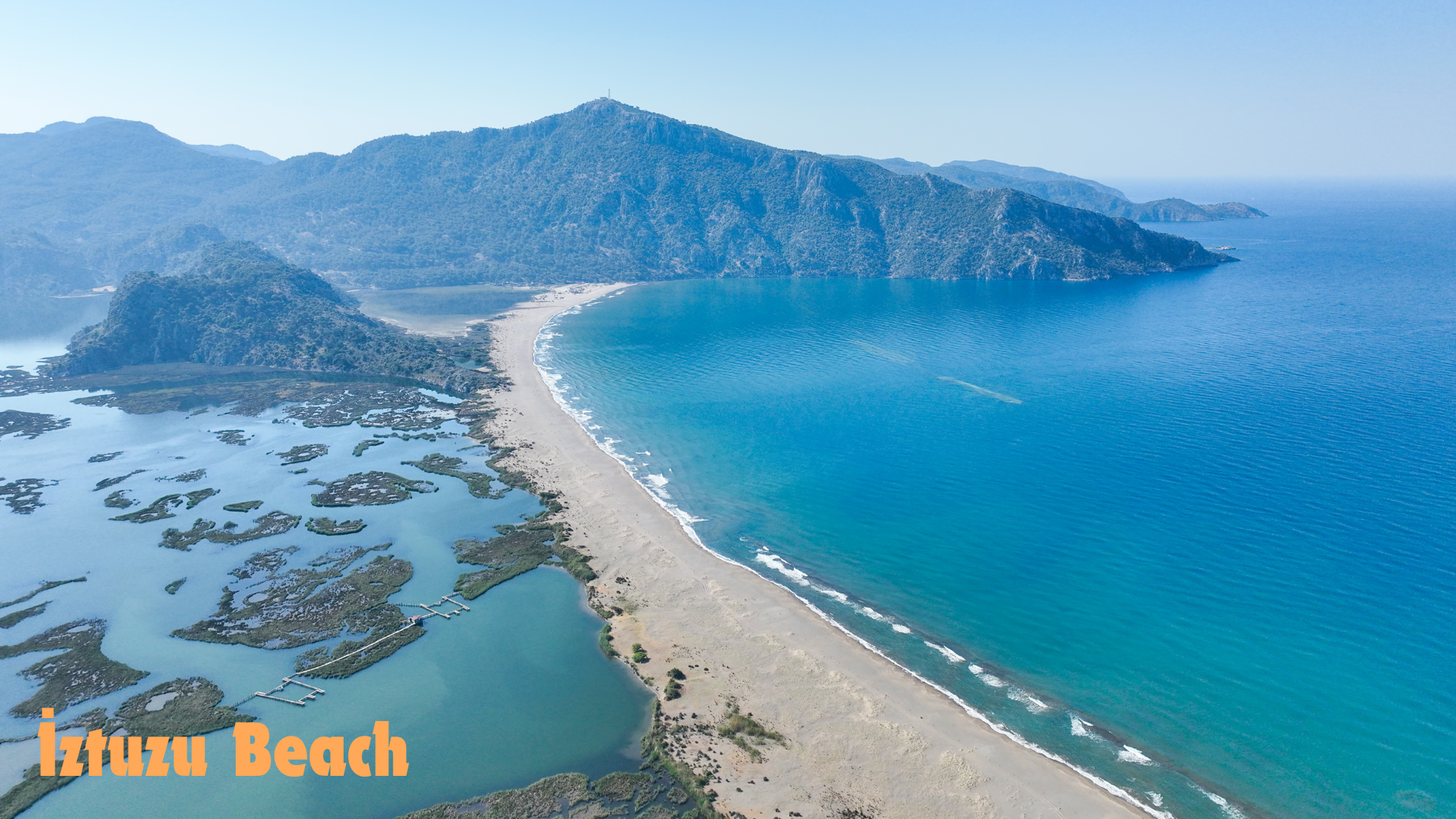 İztuzu Beach with a mountain in the background