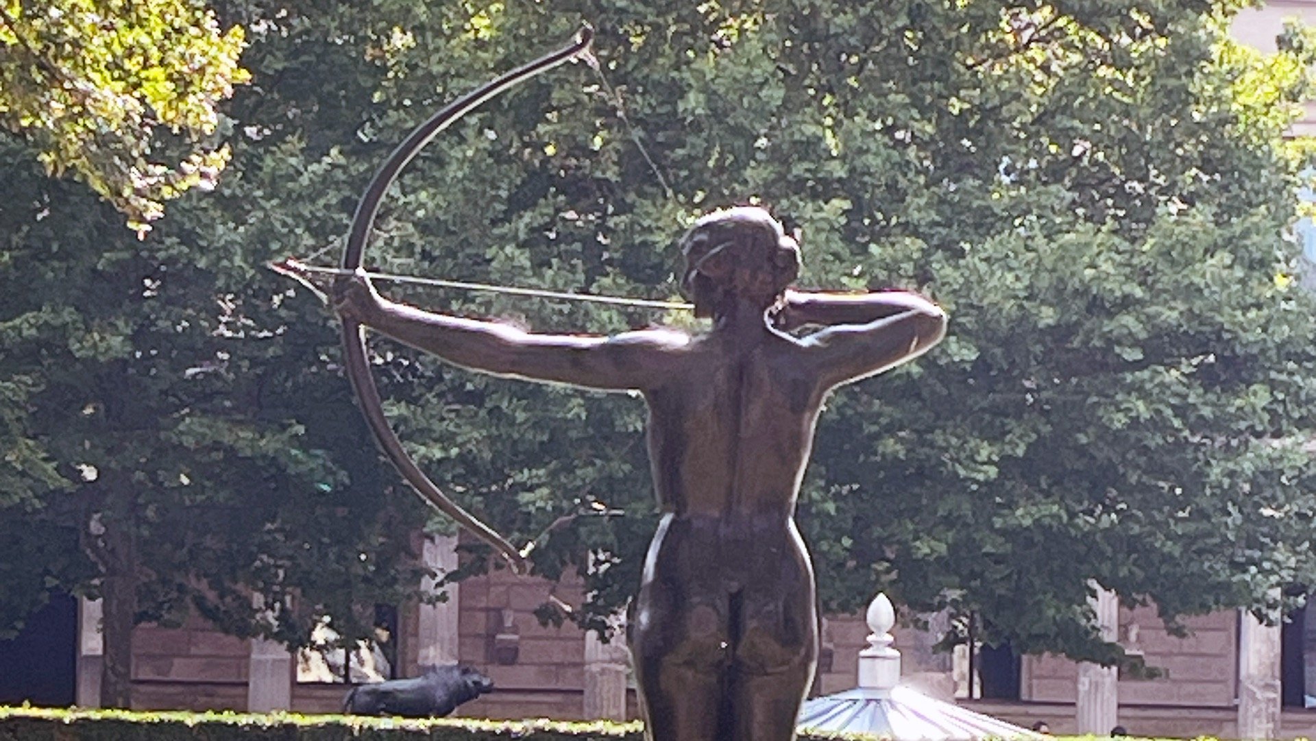 a statue of a woman with a bow and arrow