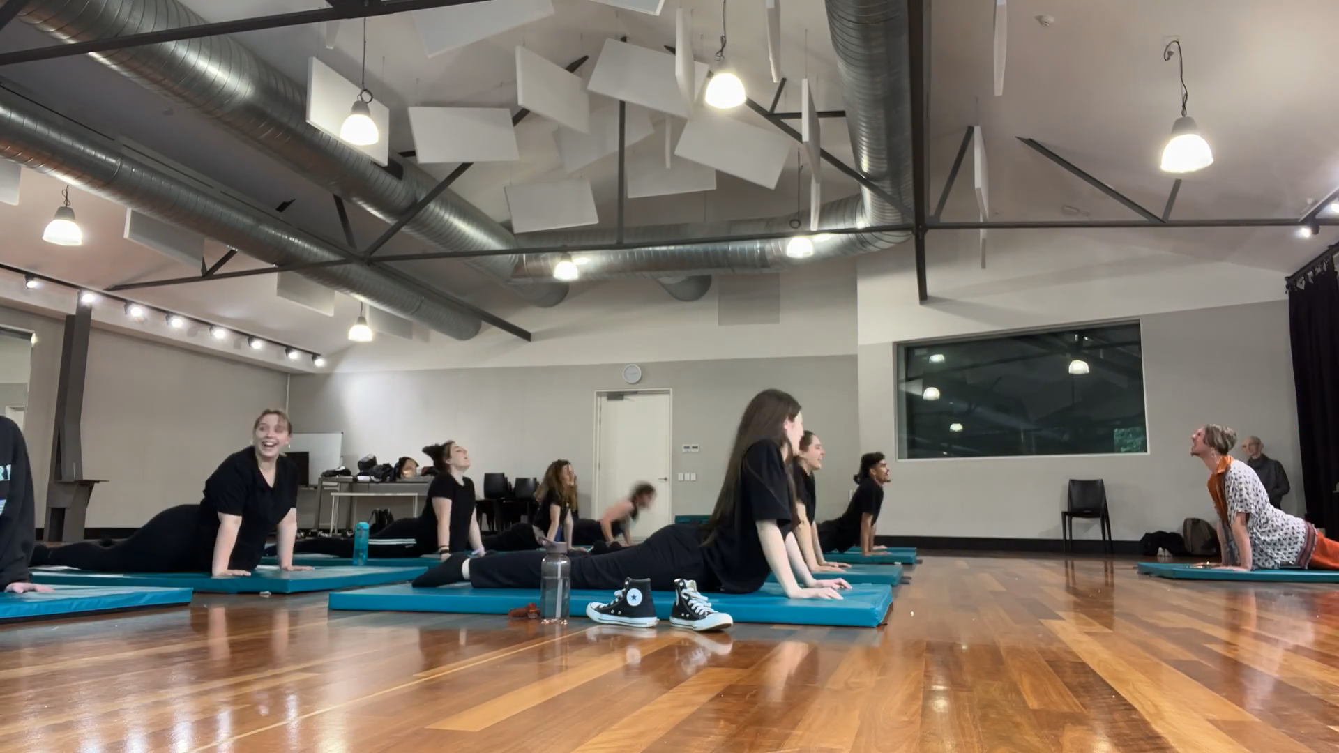 a group of people doing yoga exercises on their own mats